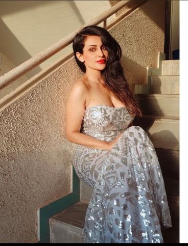 Flora Saini flaunts her perfect curves in an off-shoulder super sexy gown.